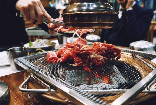Grilling-meat-in-a-Korean-restaurant-1200x853